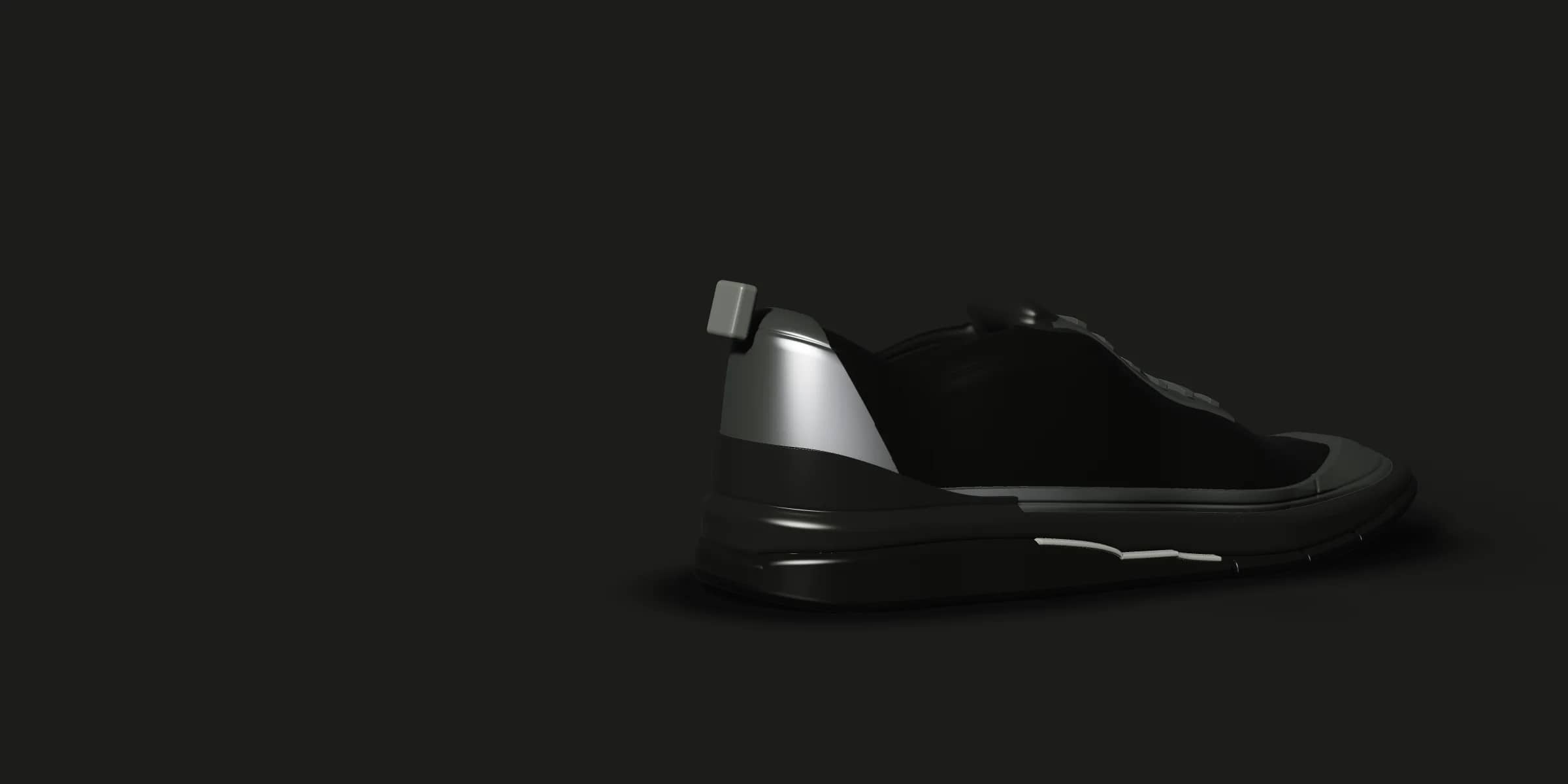 A-08 Night on a dark stage: a black knit shoe whose reflective overlays catch the light only along their edges.