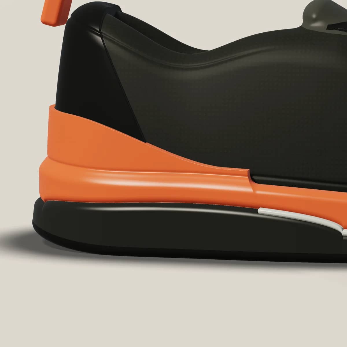 Close view of the A-01 heel: the Ember layer rising into a cradle above the Carbon carrier.