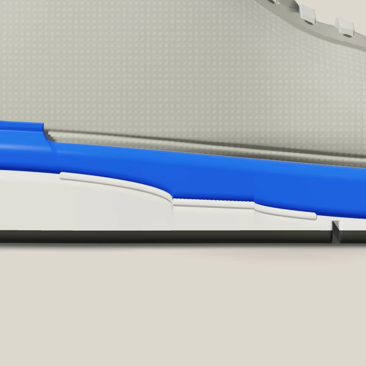 Very close side view of the midsole, a thin light plate visible between two foam layers.